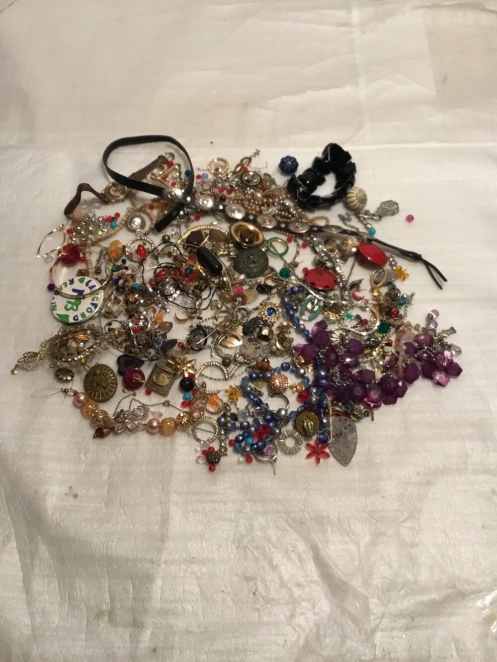 Large pile of old, broken scrap jewelry for crafts, repairs, stone retrieval